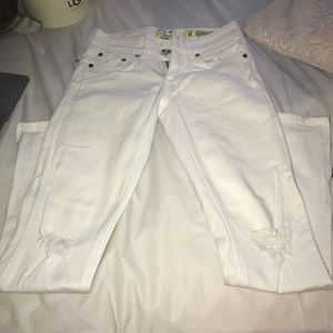 Distressed white skinny jeans